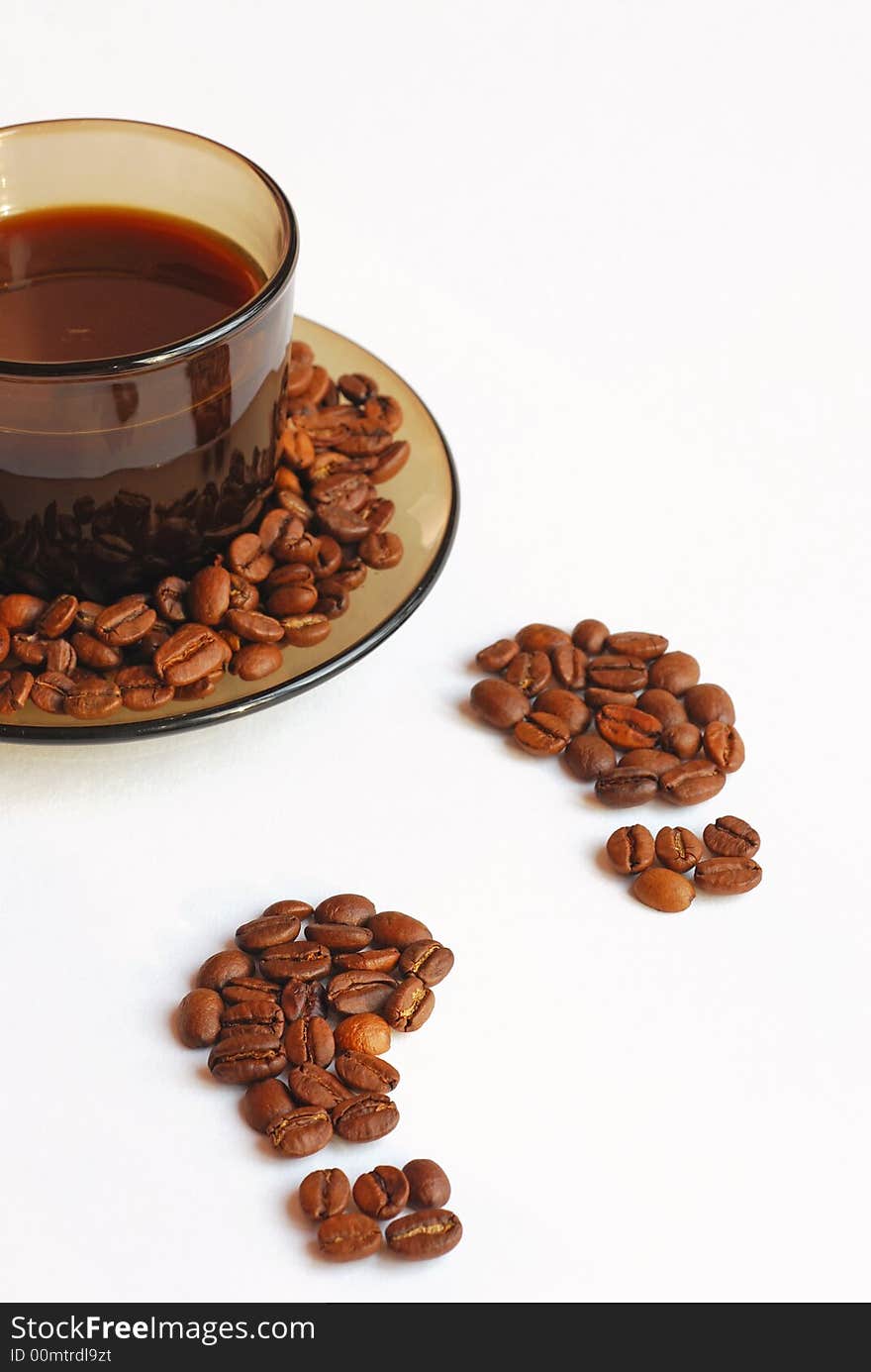 Cup of coffee and footprint from coffee beans