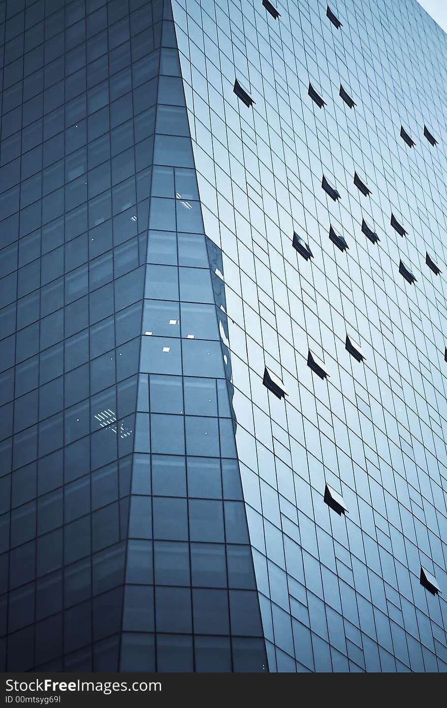 Tight crop of a modern skyscaper building with interesting lines formed by its windows. Tight crop of a modern skyscaper building with interesting lines formed by its windows.