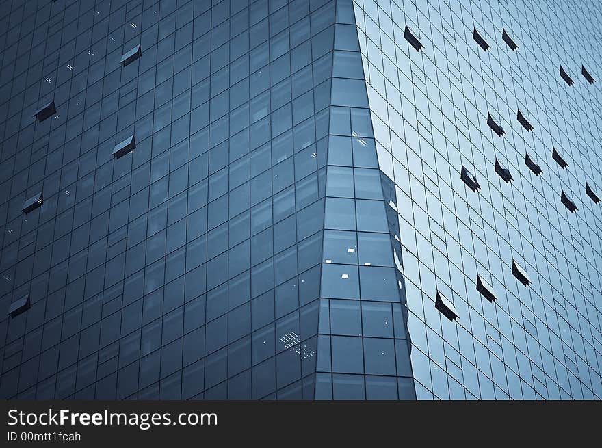 Tight crop of a modern skyscaper building with interesting lines formed by its windows. Tight crop of a modern skyscaper building with interesting lines formed by its windows.