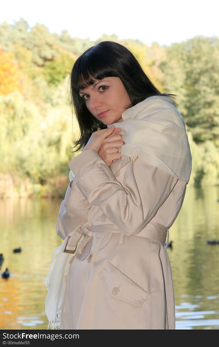 Beautiful woman walking near the lake. Beautiful woman walking near the lake