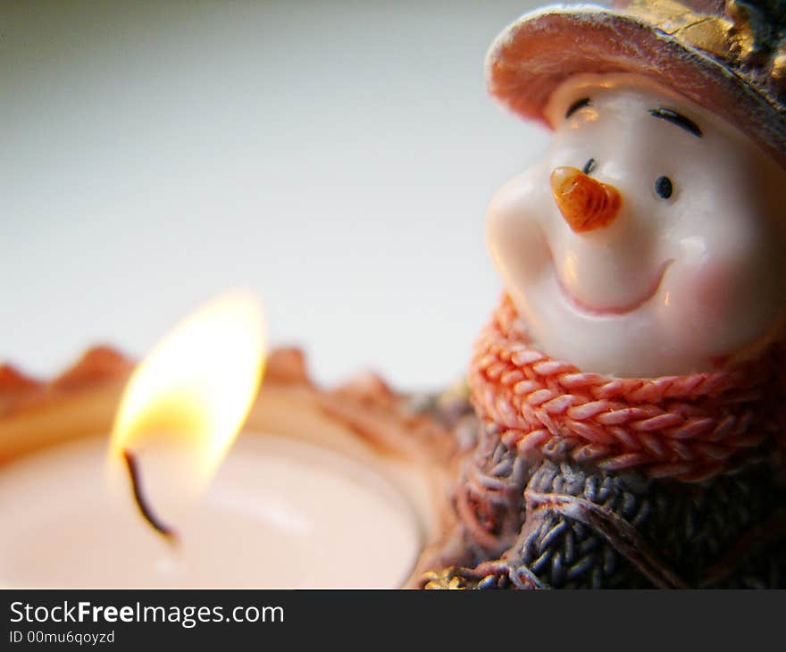 Snowman with candle