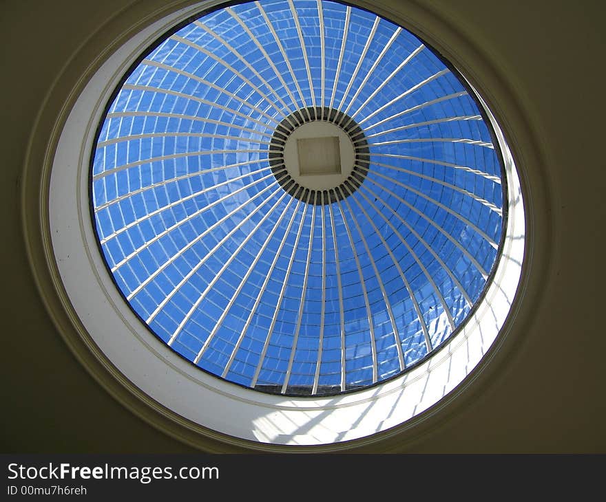 Crisp Autumn sky through domed skylight. Crisp Autumn sky through domed skylight