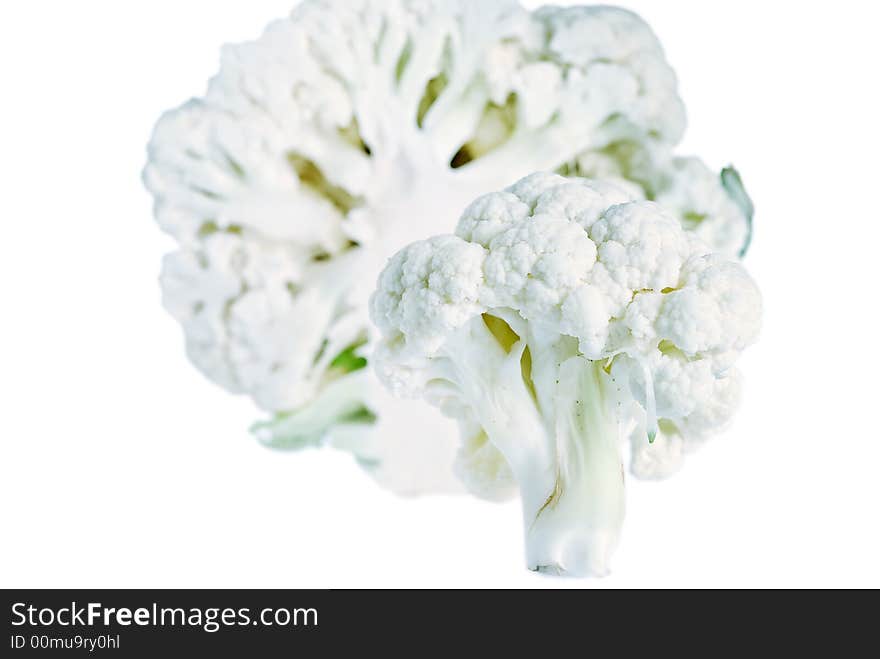 A sliced cauliflower composition with small DOF isolated on a white background