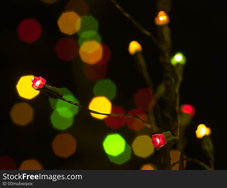 LED lights on wires in the shape of a Christmas tree. LED lights on wires in the shape of a Christmas tree