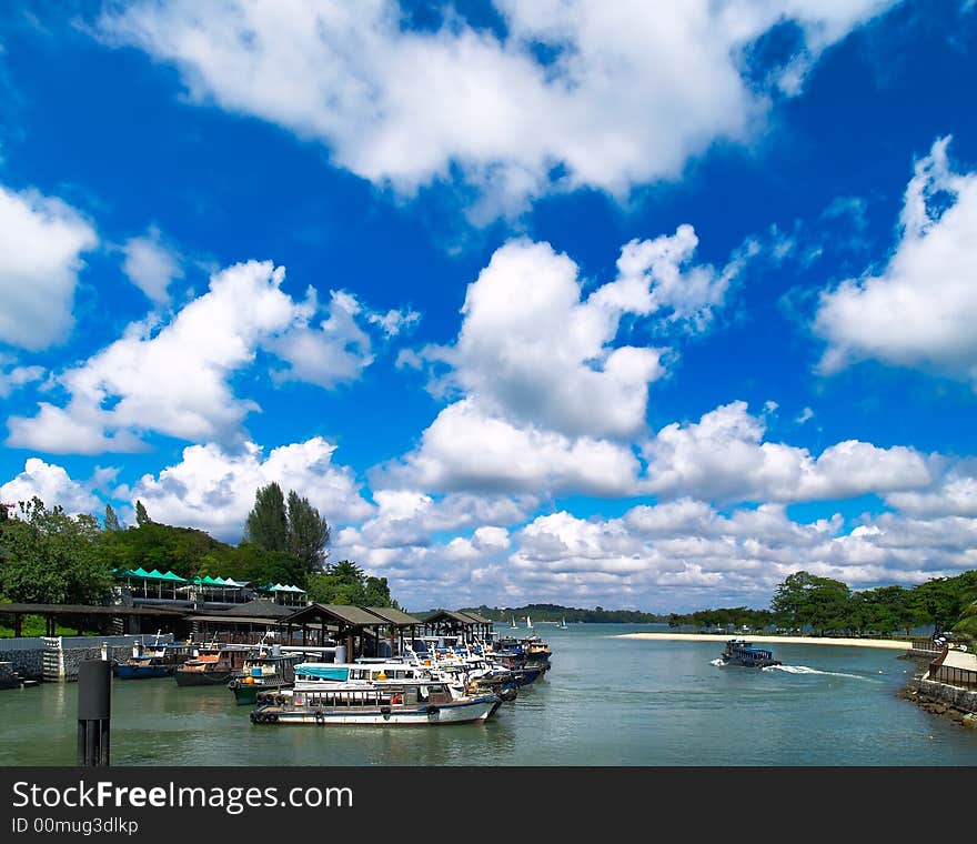 An ferry terminal at a river mouth under a cloudy sky. An ferry terminal at a river mouth under a cloudy sky