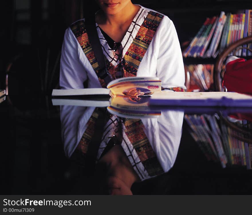 Oriental girl reading book