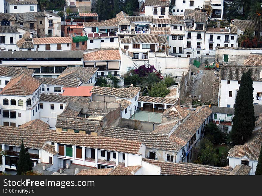 Aerial view of housing in Granada, Spain- For the most part, Europeans hang dry their clothes and linens, as seen in the photo. Also, there were no people outside. Aerial view of housing in Granada, Spain- For the most part, Europeans hang dry their clothes and linens, as seen in the photo. Also, there were no people outside.