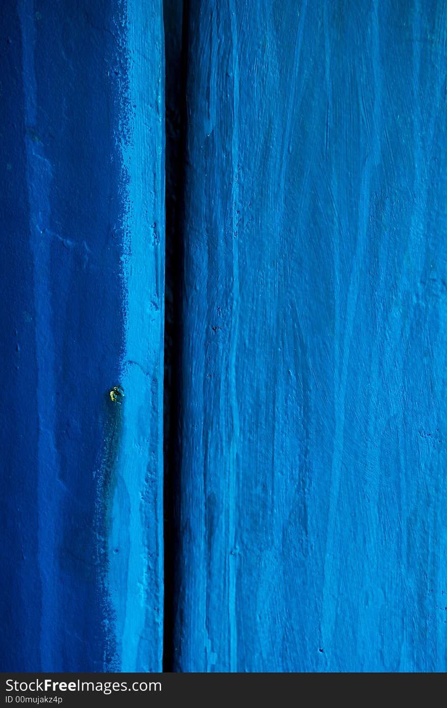 Image shows a blue wooden surface, photographed close-up in Greece