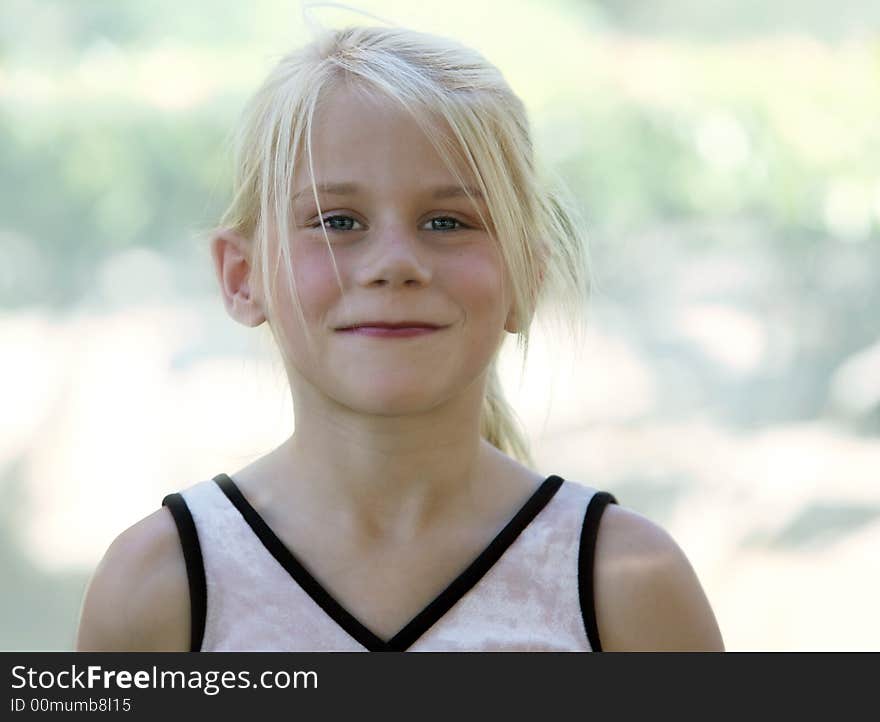 A funny blond girl smiling