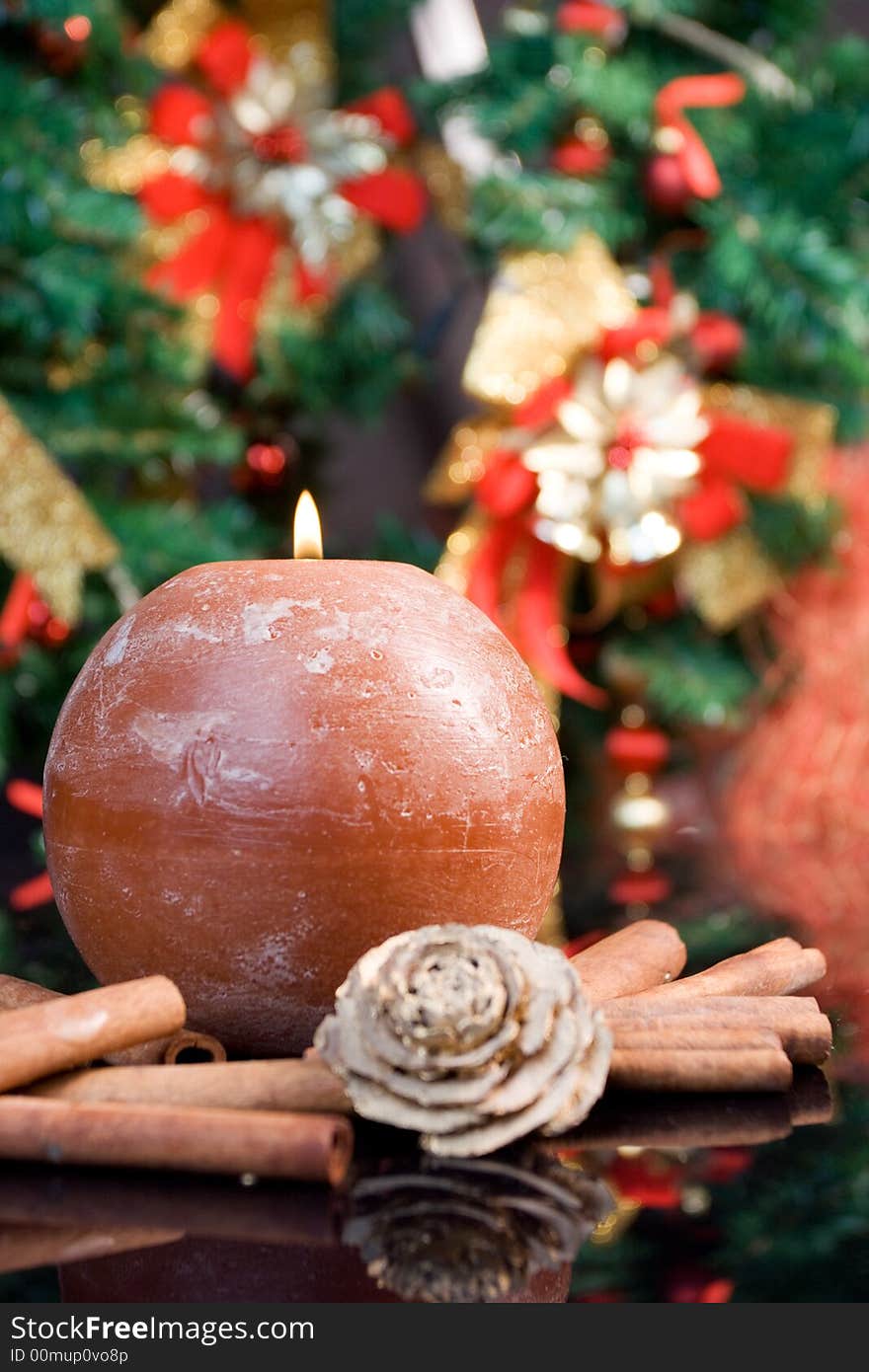 Christmas composition with candle and cinnamon. Christmas composition with candle and cinnamon