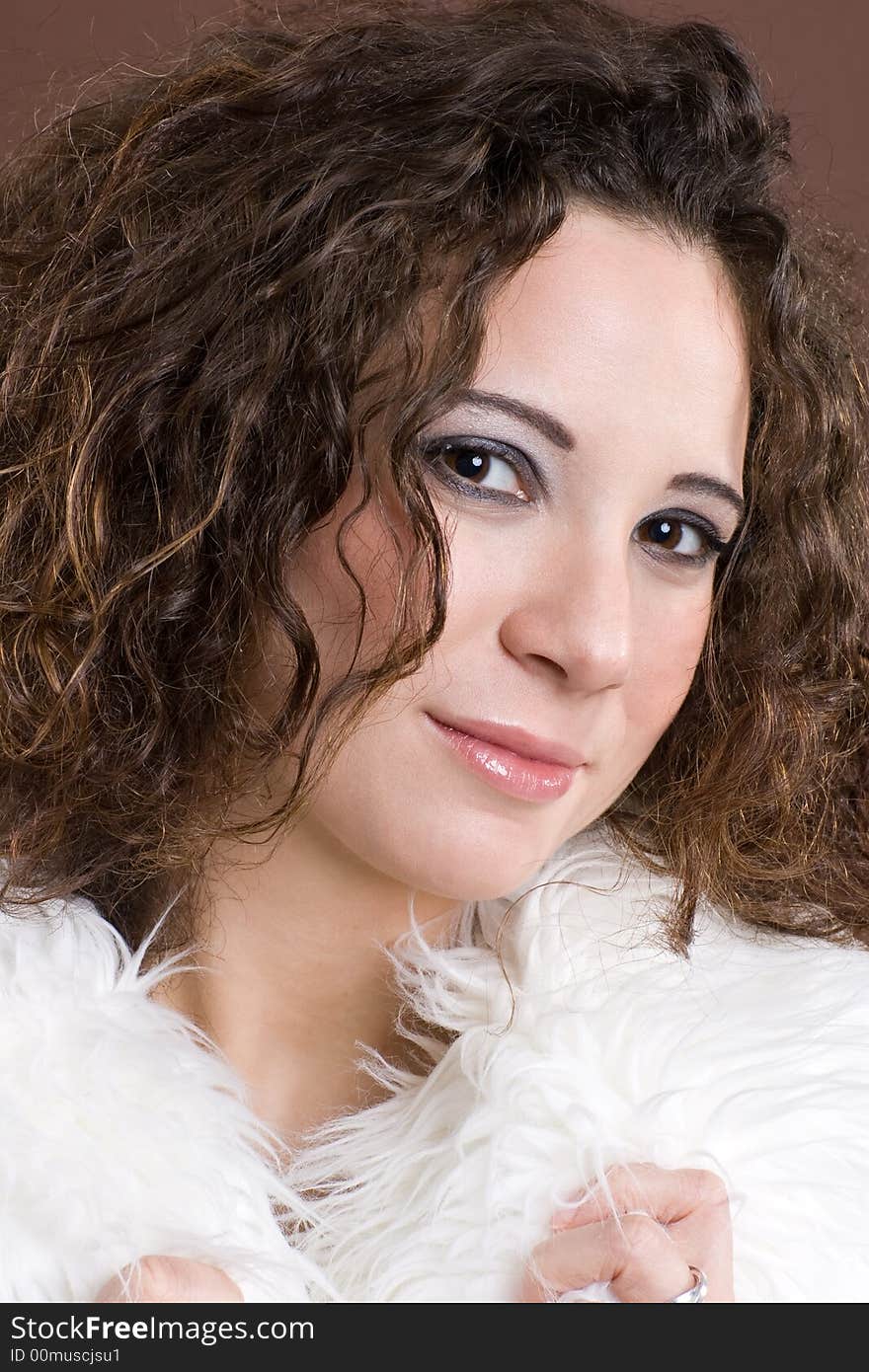 Young woman with white featherboa. Young woman with white featherboa.