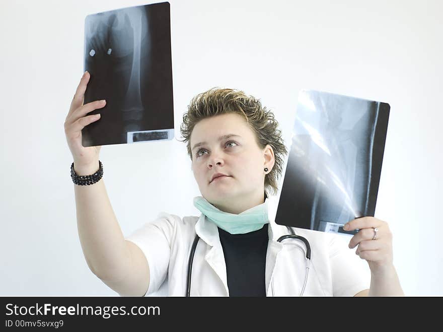 Female doctor checking x-ray results