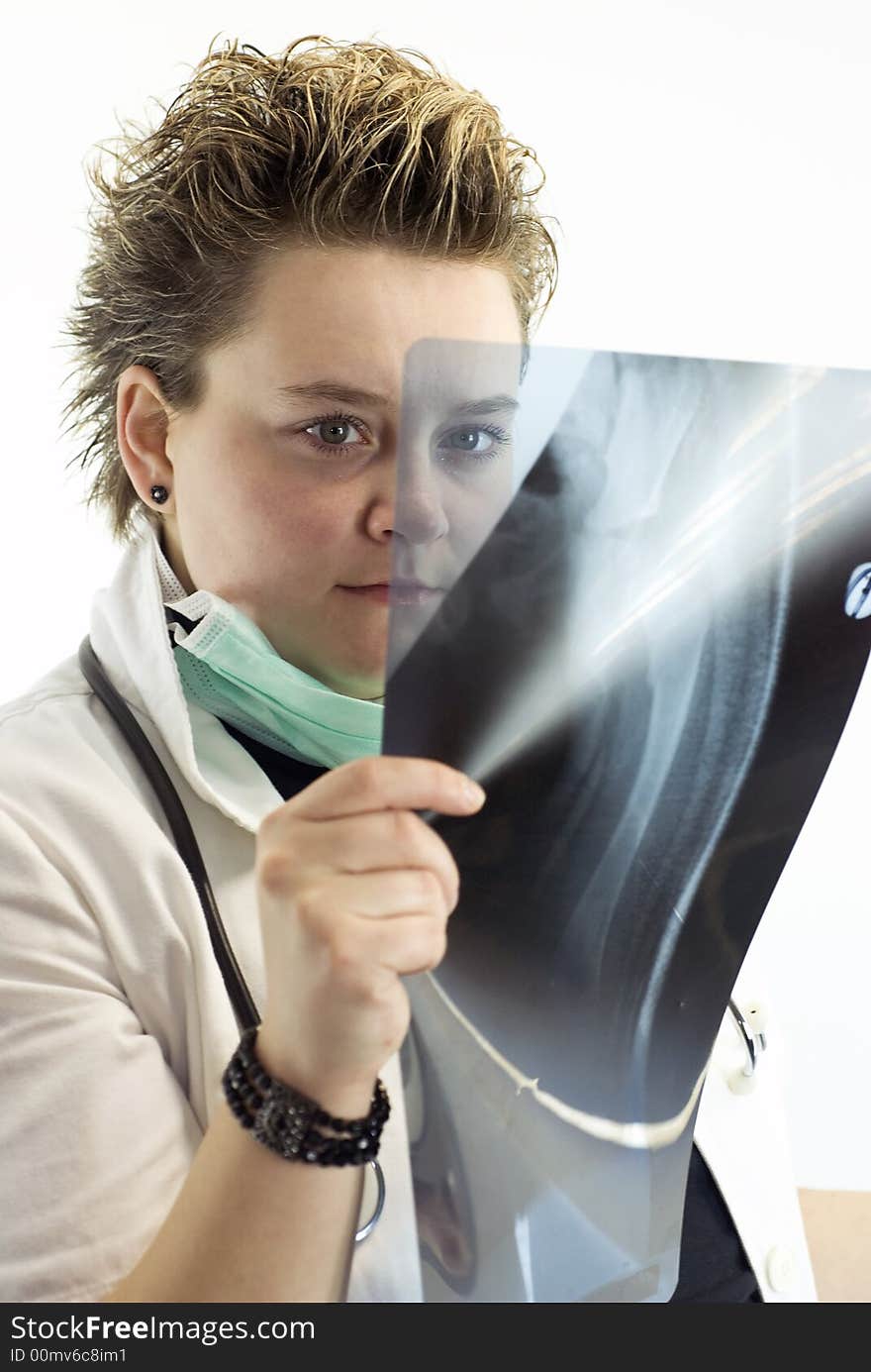 Female doctor checking x-ray results. Female doctor checking x-ray results