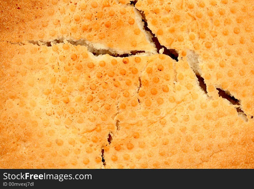 The cracked crust of bread, background