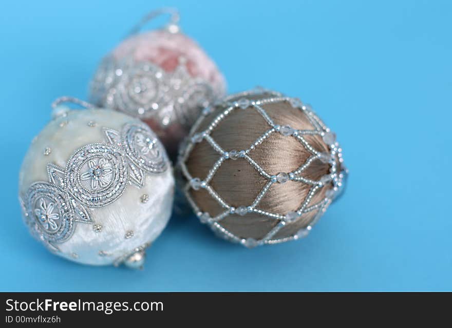 Ornate christmas ornaments on a blue background. Ornate christmas ornaments on a blue background