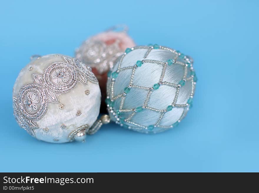 Ornate christmas ornaments on a blue background. Ornate christmas ornaments on a blue background