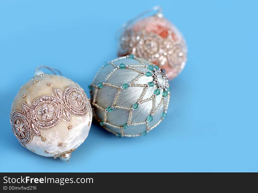 Ornate christmas ornaments on a blue background. Ornate christmas ornaments on a blue background