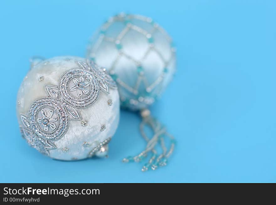 Ornate christmas ornaments on a blue background. Ornate christmas ornaments on a blue background