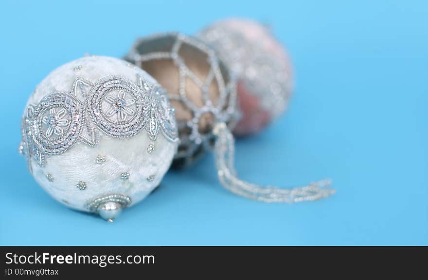 Ornate christmas ornaments on a blue background. Ornate christmas ornaments on a blue background