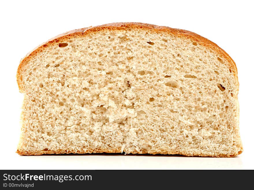 Slised loaf of fresh bread, isolated on white