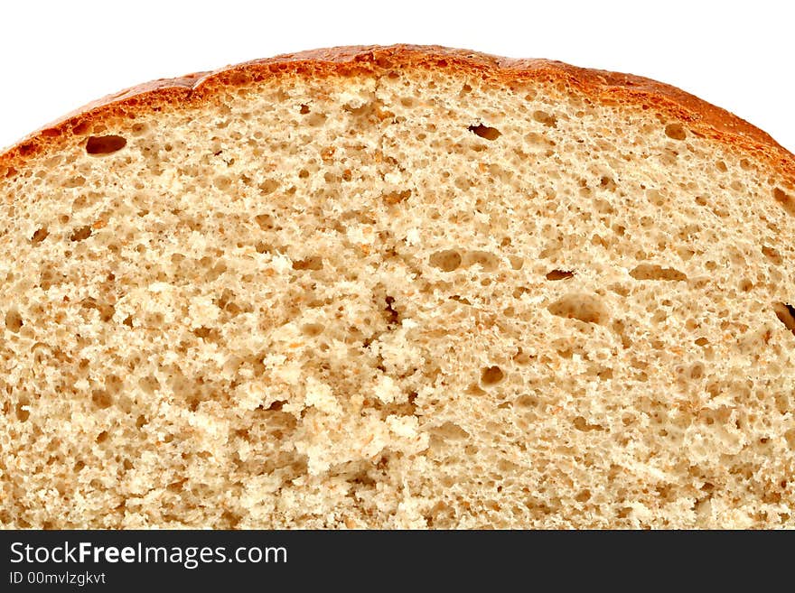 Slised loaf of fresh bread, isolated on white