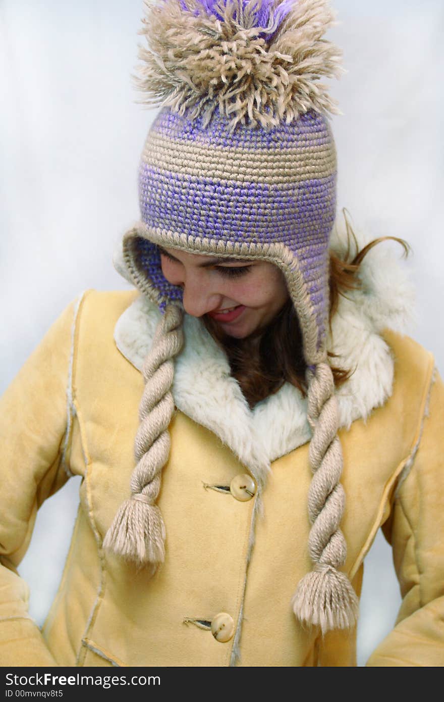 Winter portrait of beautiful young woman which freezes