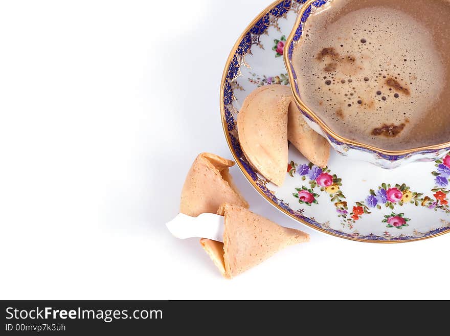 Cup of cappuccino and fortune cookie with blank card