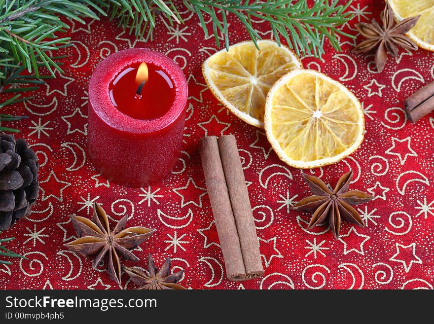 Christmas still life with candle and spices