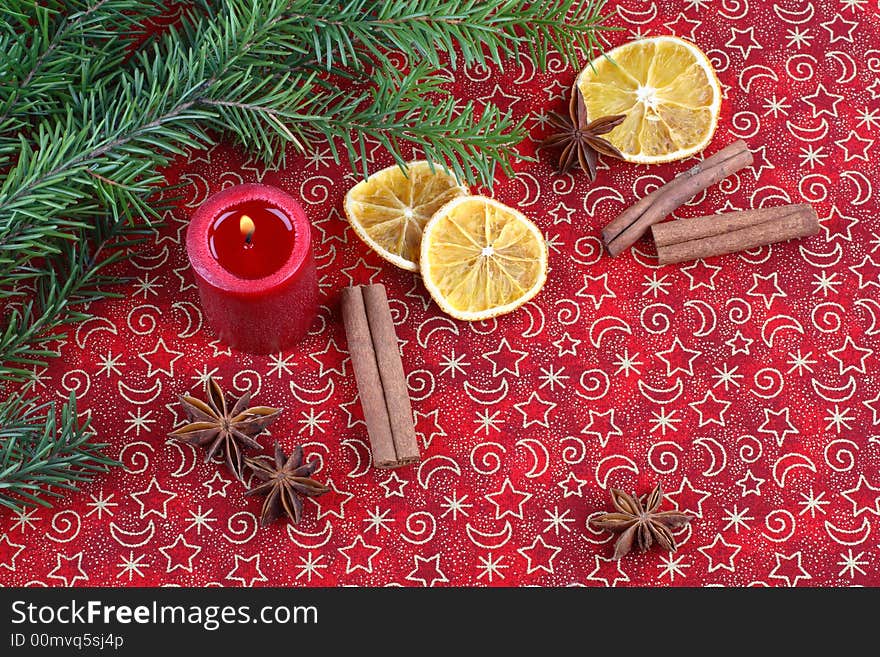 Christmas still life with candle and spices