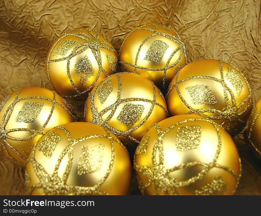 Few beautiful gold bulbs on yellow background