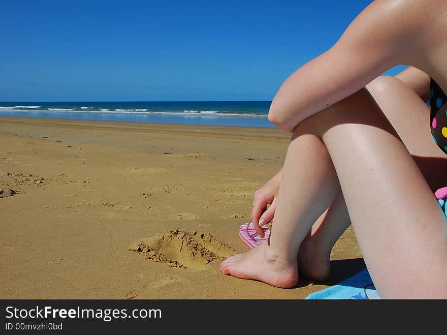 Women on a Beach bright blue sky