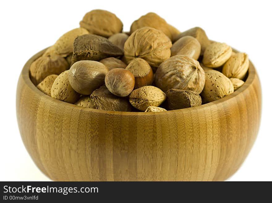 Wooden bowl with variety of nuts. Wooden bowl with variety of nuts