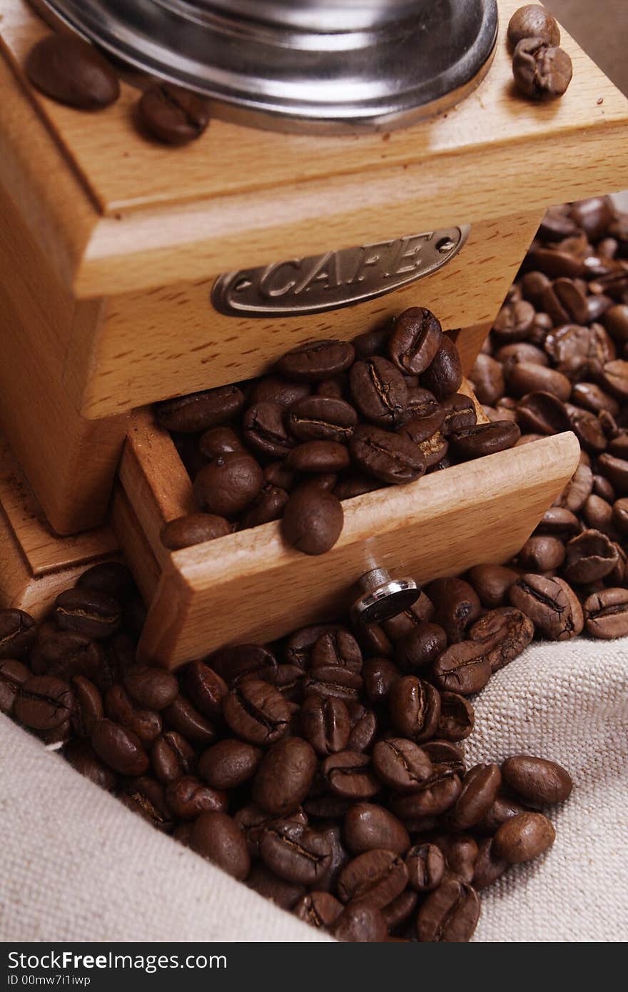 Coffee background: Close-up of a beans, cup, mill. Coffee background: Close-up of a beans, cup, mill