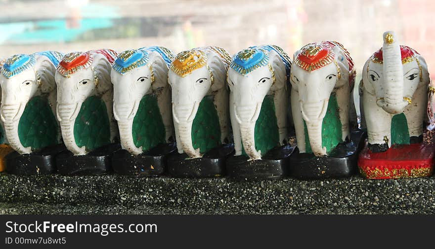 Row of white elephant statues. Row of white elephant statues.