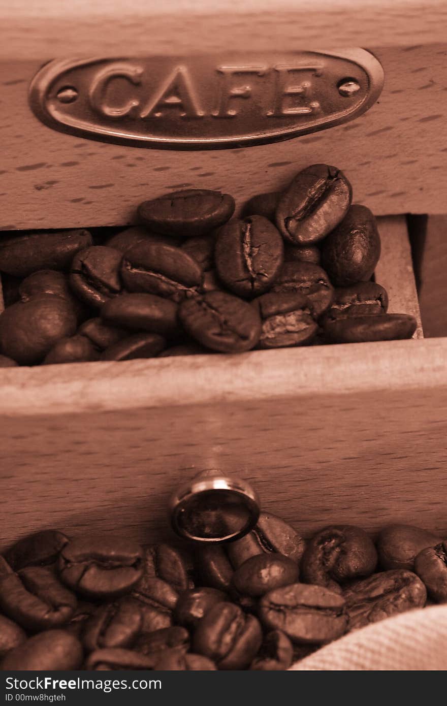 Coffee background: Close-up of a beans, cup, mill. Coffee background: Close-up of a beans, cup, mill