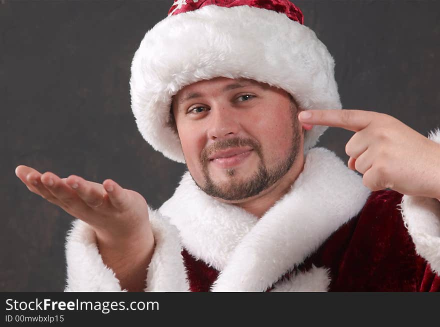 An image of Santa Claus keeping something imaginary. An image of Santa Claus keeping something imaginary