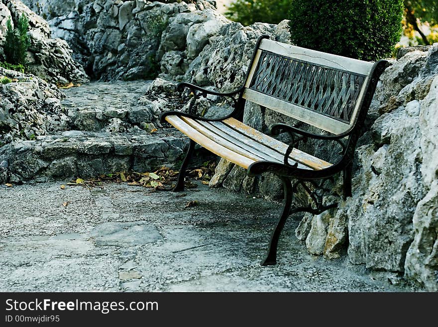 Bench in the nature surrounded by stones.