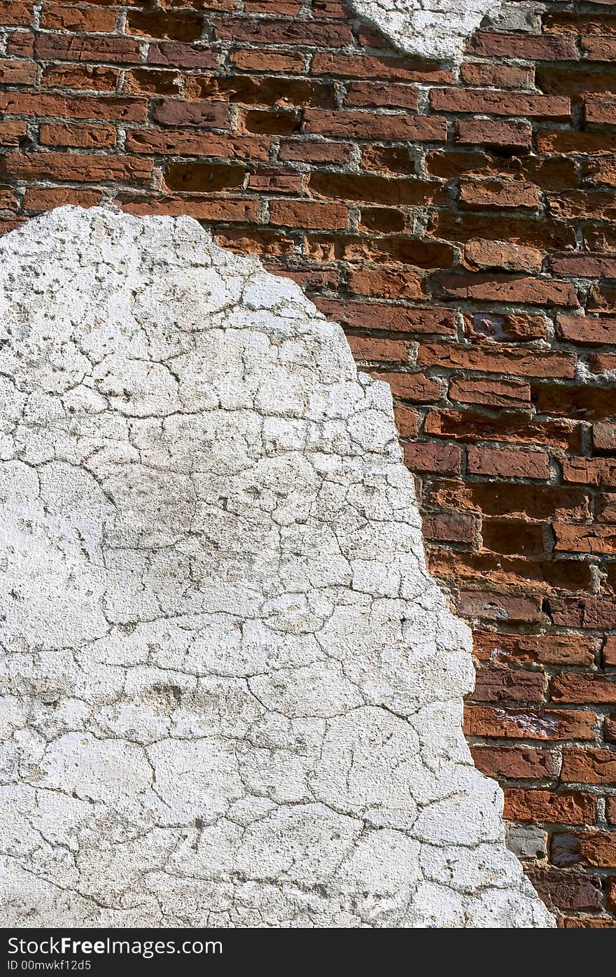 Old wall with the fallen off plaster, the brick is seen. Old wall with the fallen off plaster, the brick is seen