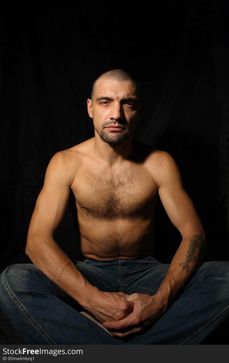 Man sitting and meditation, black background. Man sitting and meditation, black background