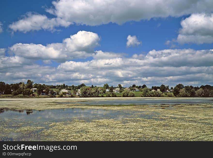 River on a background of village. River on a background of village