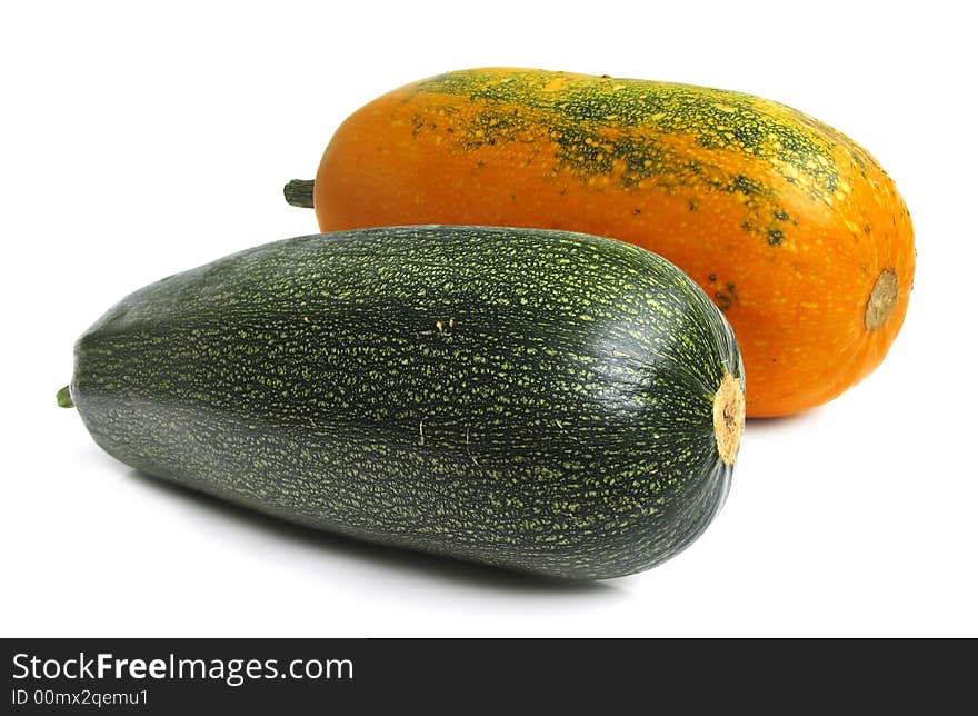 Yellow and green summer squashes on white background