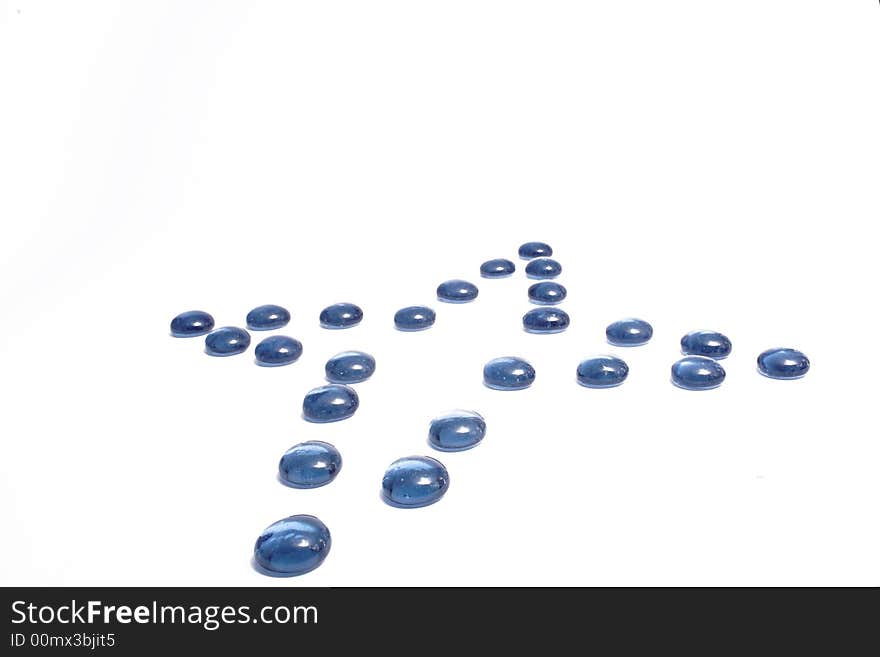 Violet glass pebbles on the white background