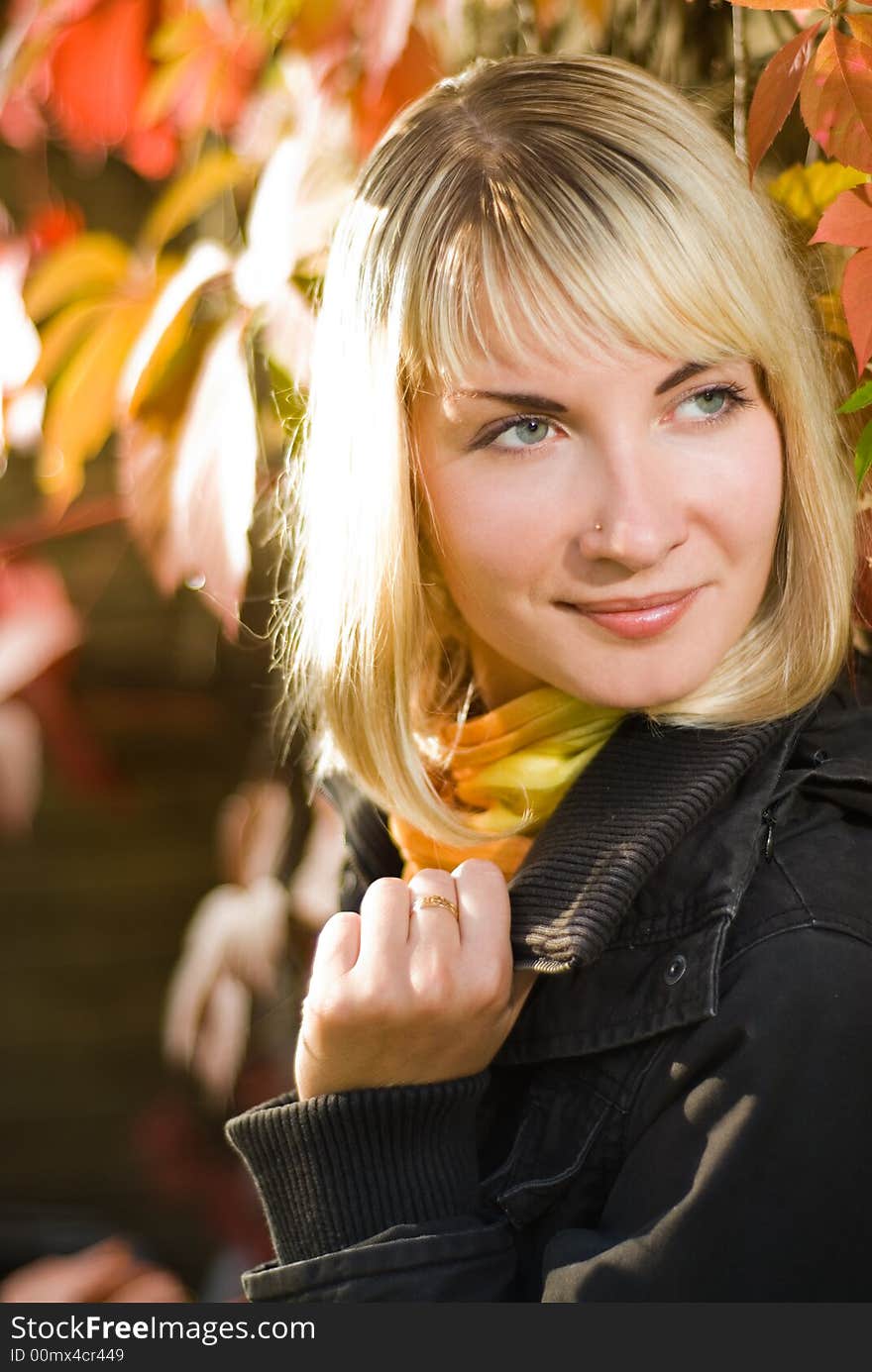 Sexy blond girl on autumn background