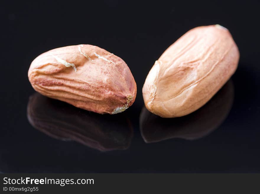 Two nuts that have been removed from their shell. Two nuts that have been removed from their shell