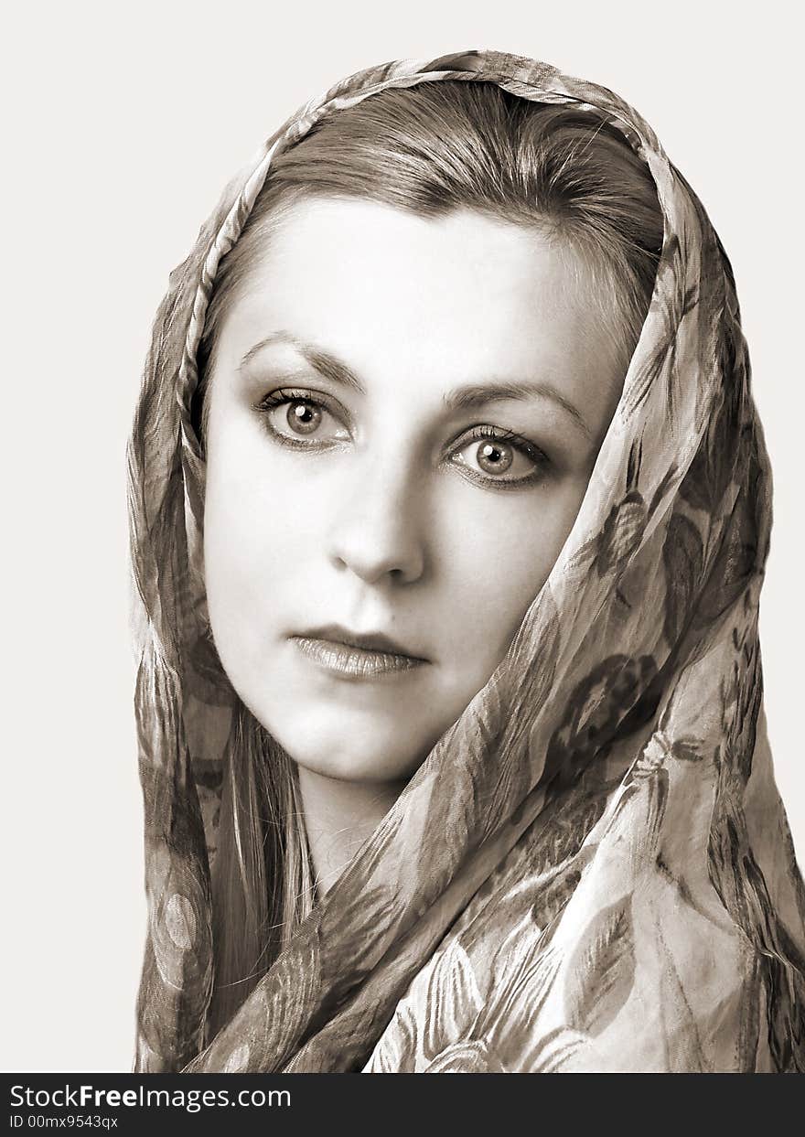 Portret of sad girl with shawl on head. In sepia. Portret of sad girl with shawl on head. In sepia.