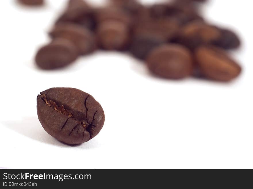 Coffee seeds close-up isolated on white background