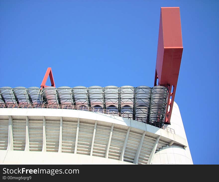 A part of the S. Siro stadium in Milan under a blue sky