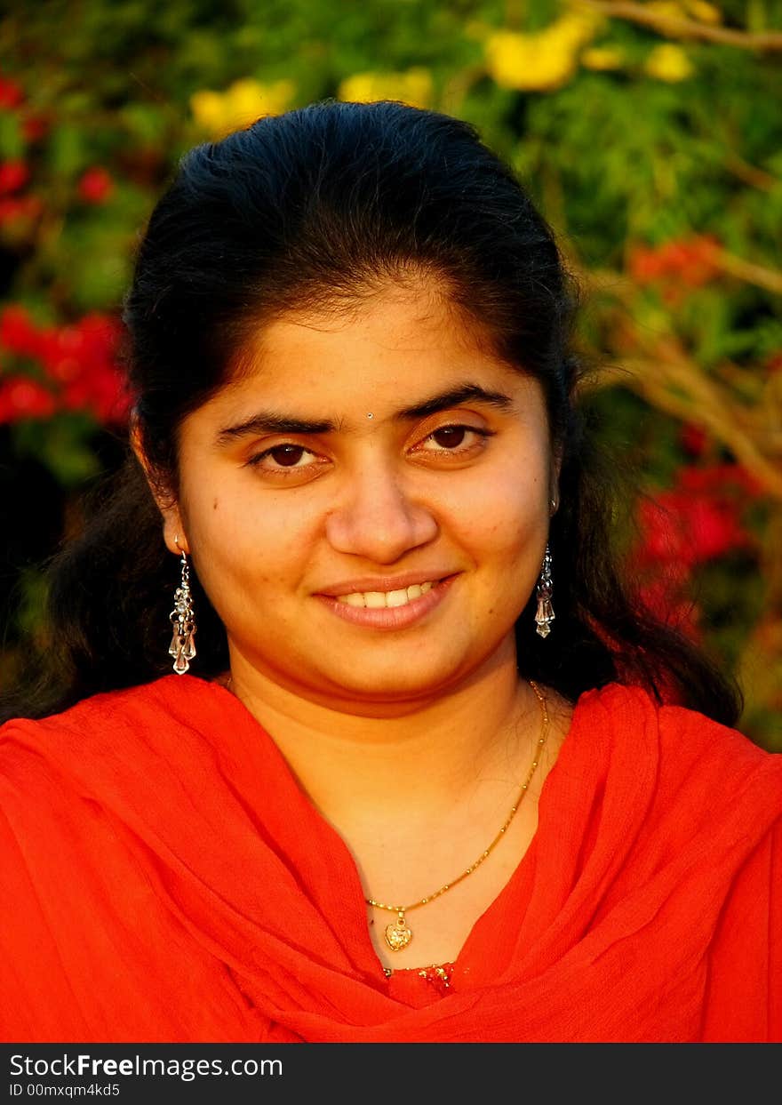 A portrait of a simple indian girl with bright face. A portrait of a simple indian girl with bright face.