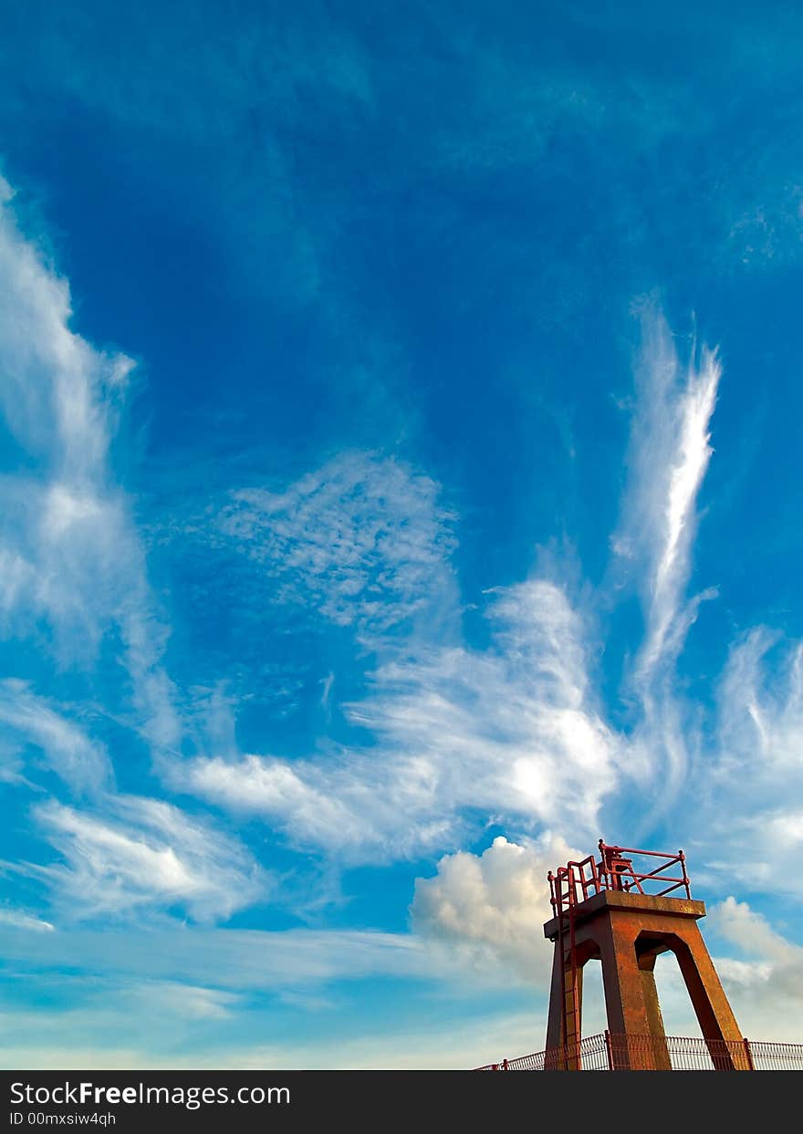 Disused red beacon constructed as part of a fortification on Singapore against a Japanese invasion that never came, as seen against a dramatic sky on a late afternoon, at Labrador Park.