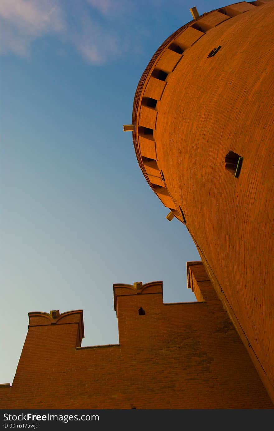 Red Kremlin tower and wall at the sunset